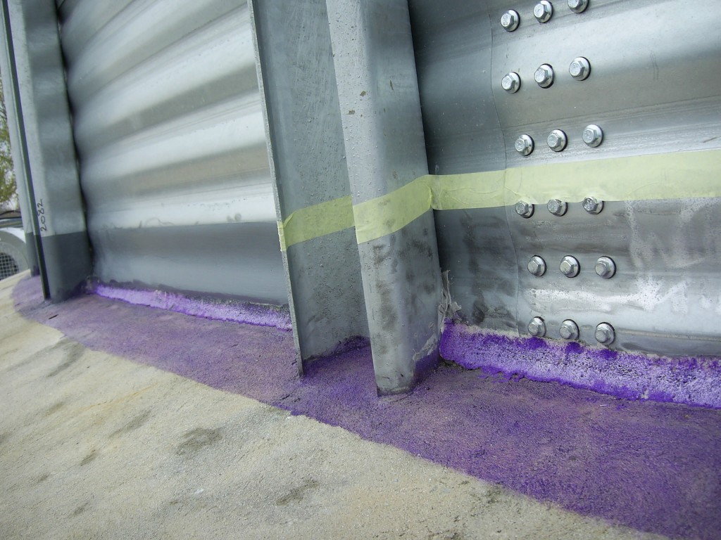 Belzona surface primer applied to concrete tank base before sealing