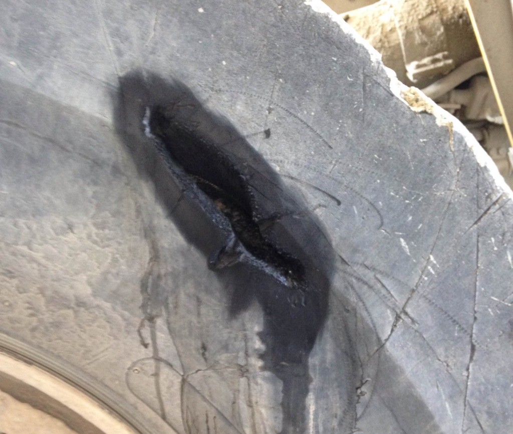 Rubber tyre treated with a Belzona surface primer prior to repair