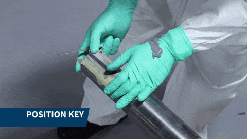 Insert the new key in the keyway and firmly press the key to allow the product to exude