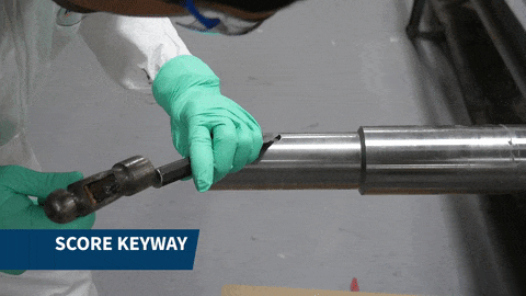 Score the inner surface of the keyway