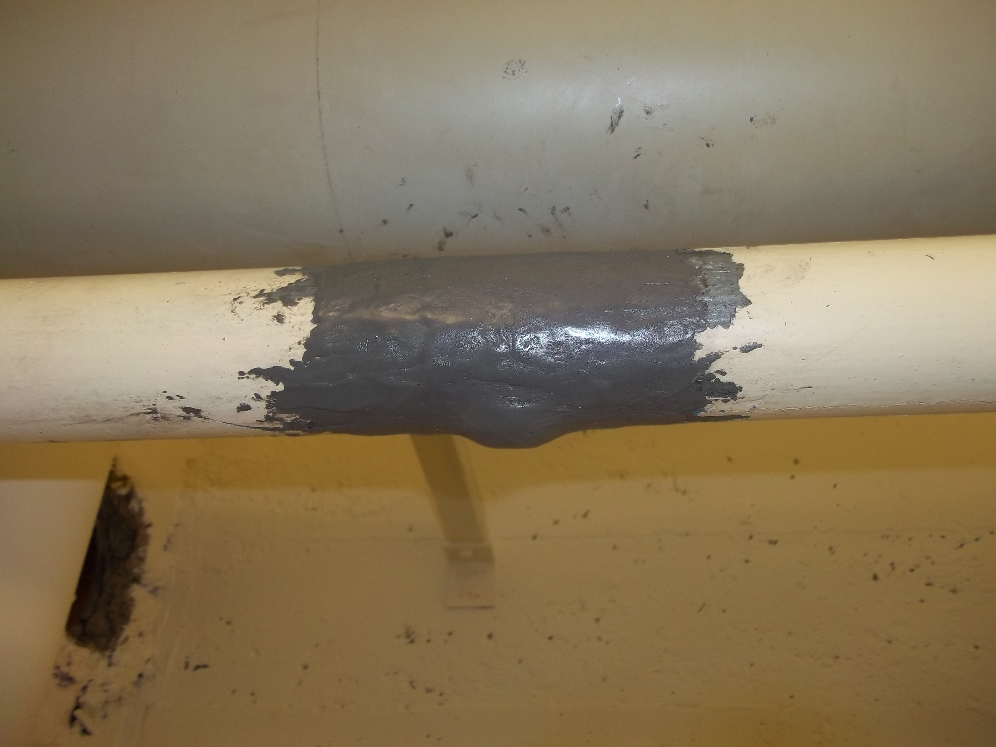 Emergency pipe repair at a school - airport facilities maintenance