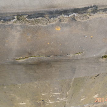 A close up of damage on the tank