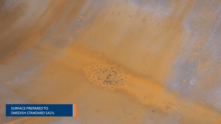 Surface of the vessel showing pitting corrosion before and after grit blasting 
