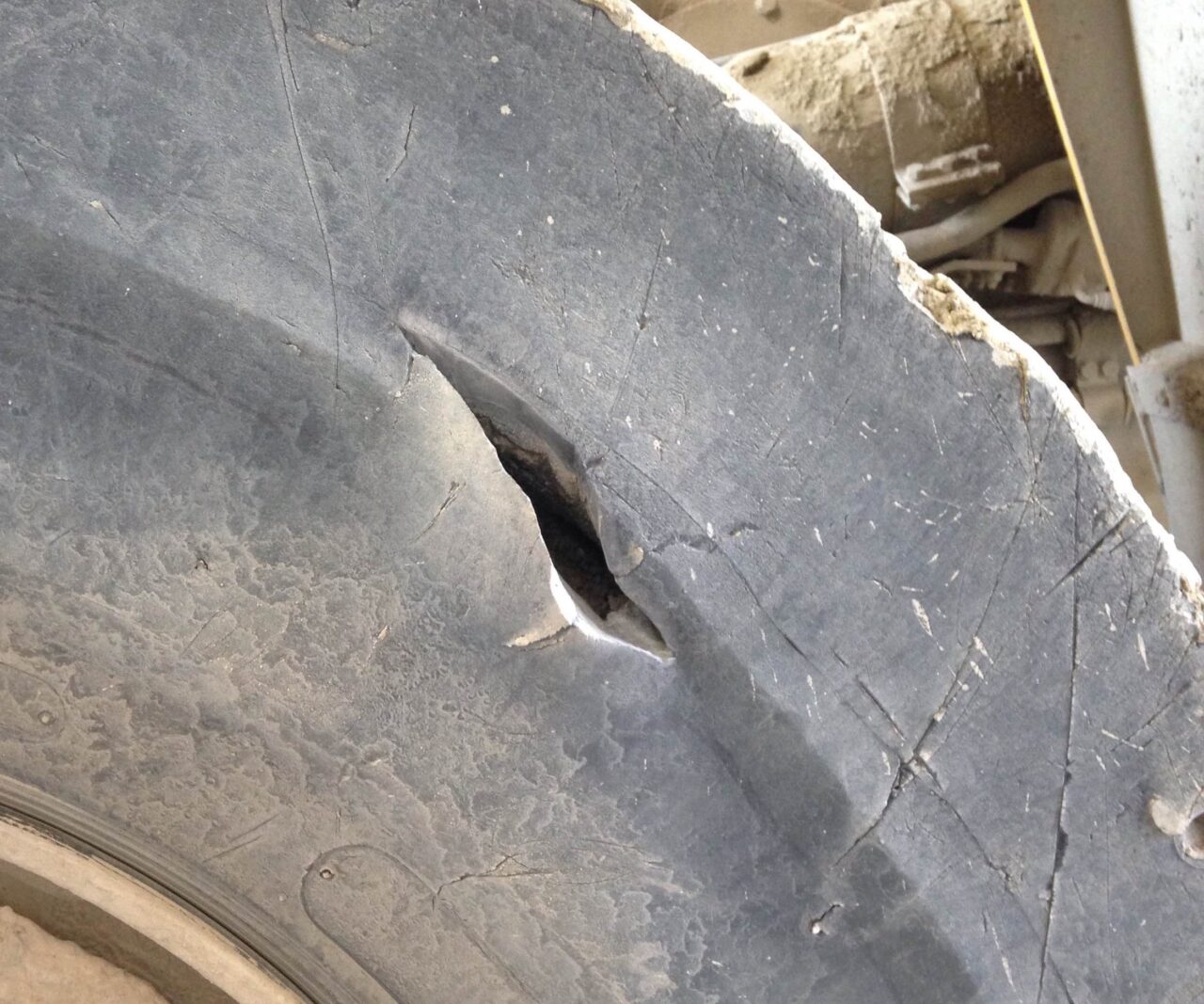 A tire sidewall exhibited a visible crack and required immediate repair