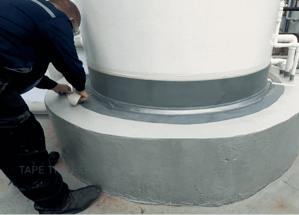 Define the area on the concrete base with a tape for the coating