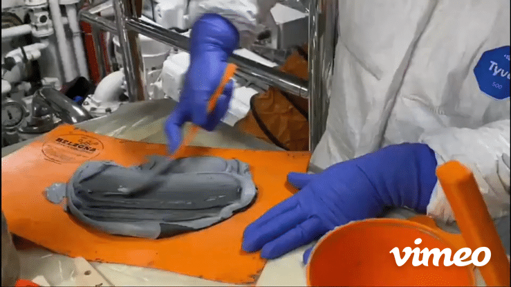 Mix the two-part epoxy repair composite using a spatula