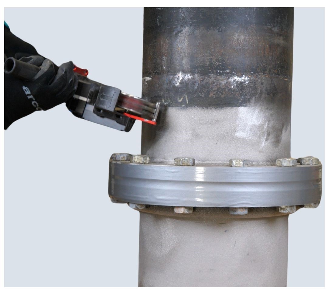 Roughen and prepare surface with a suitable power tool