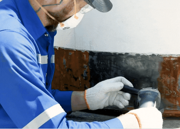Prepare the surface on the annular ring and tank wall with a handheld tool