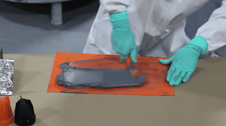 Mix the two-part epoxy metal adhesive using a spatula