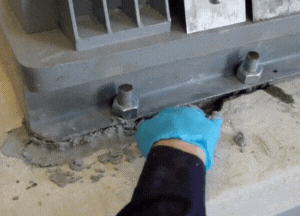 Pack Belzona 4111 (Magma-Quartz) in the voided concrete foundation 