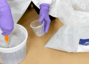 Add Belzona 4111 (Magma-Quartz) aggregate into the mixed resin