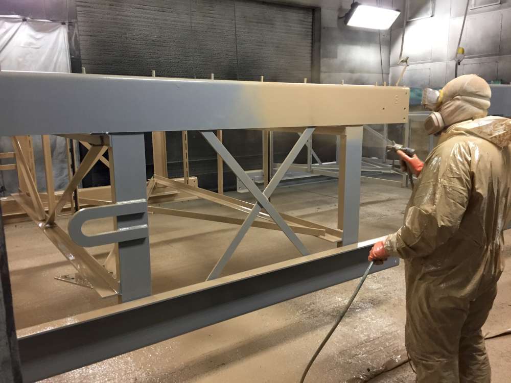Application of second coat of Belzona epoxy coating to traveling screens